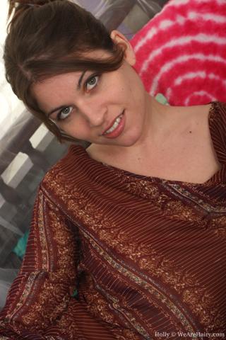 Holly in We Are Hairy set Hairy Holly strips on the sofa